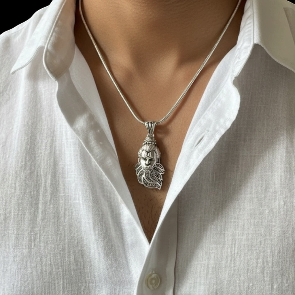 Myver sterling silver Lord Hanuman pendant necklace with intricate detailing worn on a white shirt