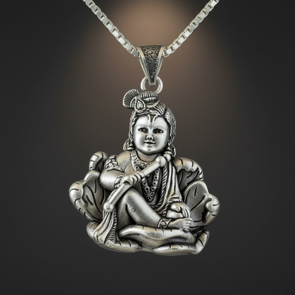 Myver sterling silver Lord Krishna pendant featuring an oxidized finish, detailed flute, and peacock feather design.